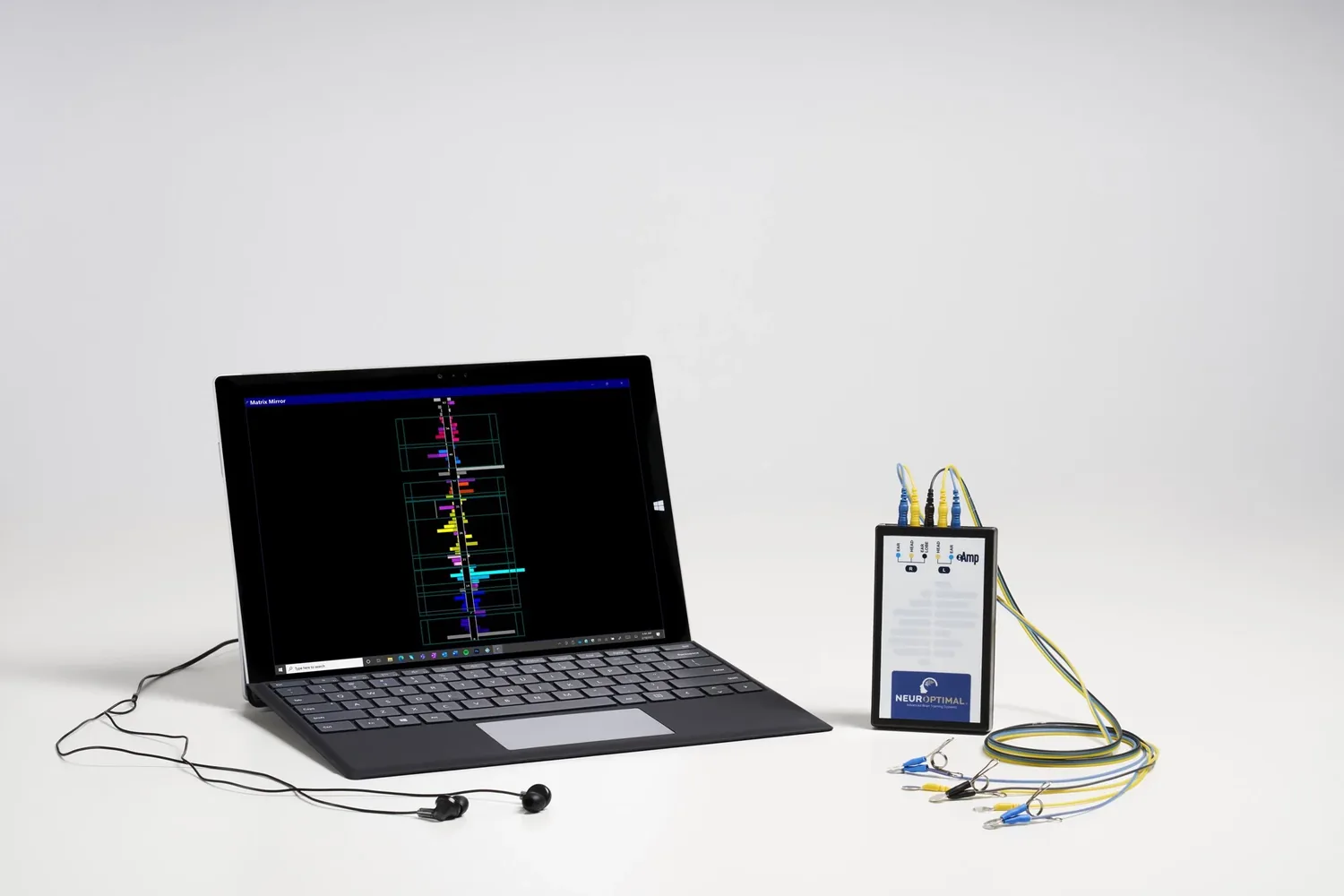 The NeurOptimal system: a laptop, the signal box, sensors and earbuds